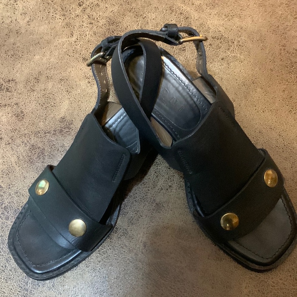 The Sandler was made in Italy. Worn very little shoe is black with brass pins
